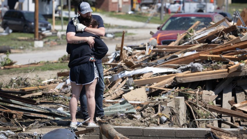 GREENFIELD, IOWA – MAY 22: People embrace in front of their home which was destroyed when a tornado tore through town yesterday afternoon on May 22, 2024 in Greenfield, Iowa. Multiple deaths and injuries have been reported from a series of tornadoes and powerful storms that hit several Midwestern states (Photo by Scott Olson/Getty Images)