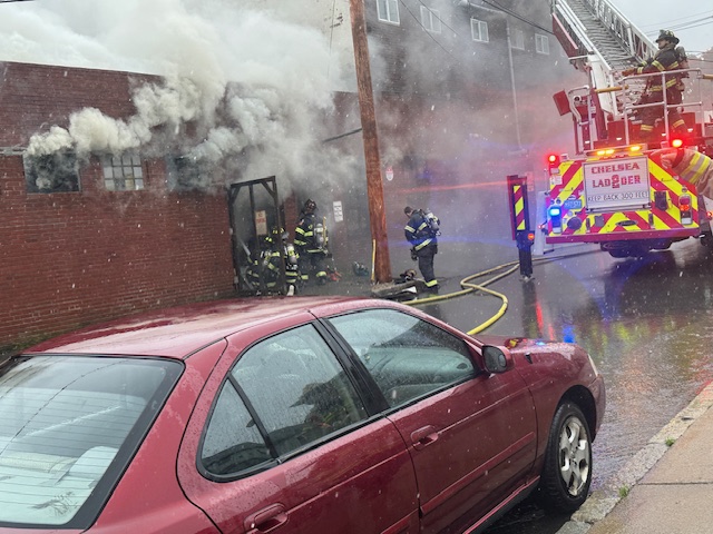 Firefighters battling a building fire in Chelsea, Massachusetts, on Thursday, May 30, 2024.