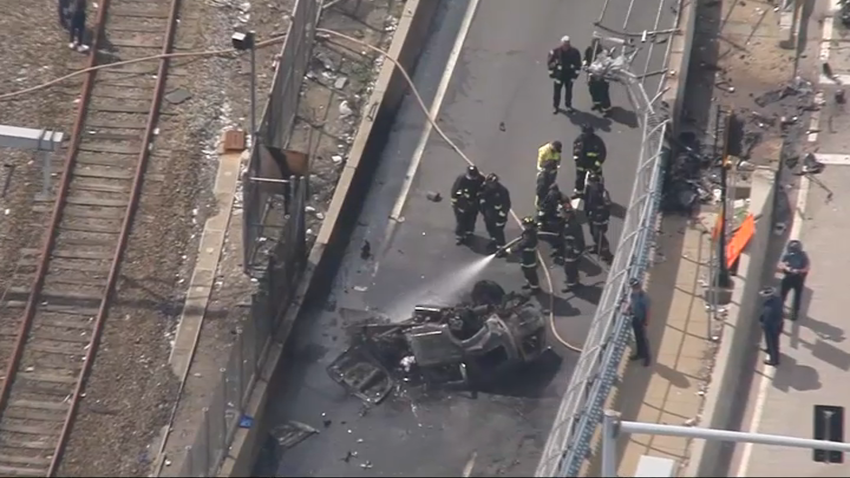 The scene of an apparent fiery car wreck on a highway ramp connected to I-93 in Boston on Wednesday, June 5, 2024.