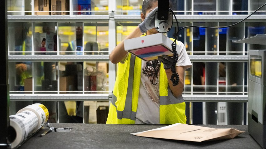 A worker prepares an Apple iPad package at an Amazon same-day delivery fulfillment center on Prime Day in the Bronx borough of New York, US, on Tuesday, July 16, 2024. Amazon.com Inc.’s Prime Day sales rose about 13% in the first six hours of the event compared with the same period last year, according to Momentum Commerce, which manages 50 brands in a variety of product categories. Photographer: Stephanie Keith/Bloomberg via Getty Images