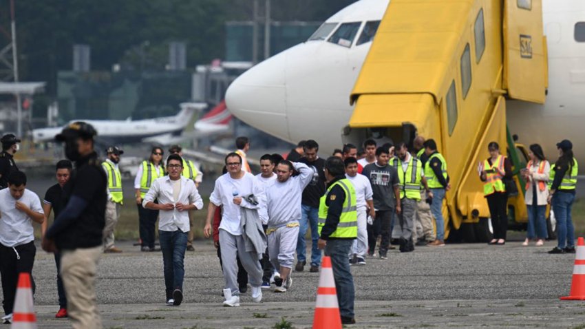 Guatemalan migrants deported from the United States walk on the airport runway upon their arrival at the Air Force Base in Guatemala City on May 11, 2023, during the last flight of returnees from the United States under Title 42. On May 11, President Joe Biden’s administration will lift Title 42, the strict protocol implemented by previous president Donald Trump to deny entry to migrants and expel asylum seekers based on the Covid pandemic emergency. (Photo by Johan ORDONEZ / AFP) (Photo by JOHAN ORDONEZ/AFP via Getty Images)