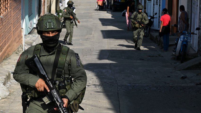 Colombian policemen patrol near the site where a car bomb went off in Miranda, Cauca department, Colombia on April 12, 2024. A car bomb exploded Thursday night in a street in Miranda, southwest Colombia, injuring 3 civilians, acccording to local authorites. (Photo by JOAQUIN SARMIENTO / AFP) (Photo by JOAQUIN SARMIENTO/AFP via Getty Images)