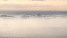 A hazy Boston skyline as smoke from a wildfire in Salem, Massachusetts, travels across the area.