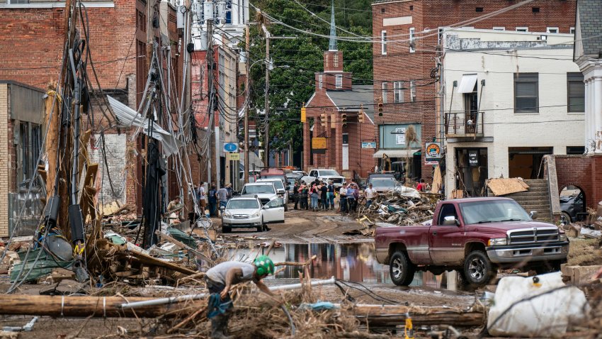 Workers, community members, and business owners clean up debris in the aftermath of Hurricane Helene.