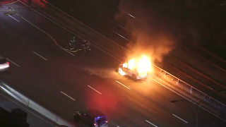 A van on fire on the Massachusetts Turnpike in Boston on Tuesday, Oct. 29, 2024.