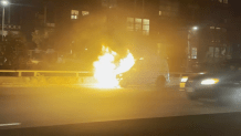 A burning van on I-90 in Boston on Tuesday, Oct. 29, 2024.