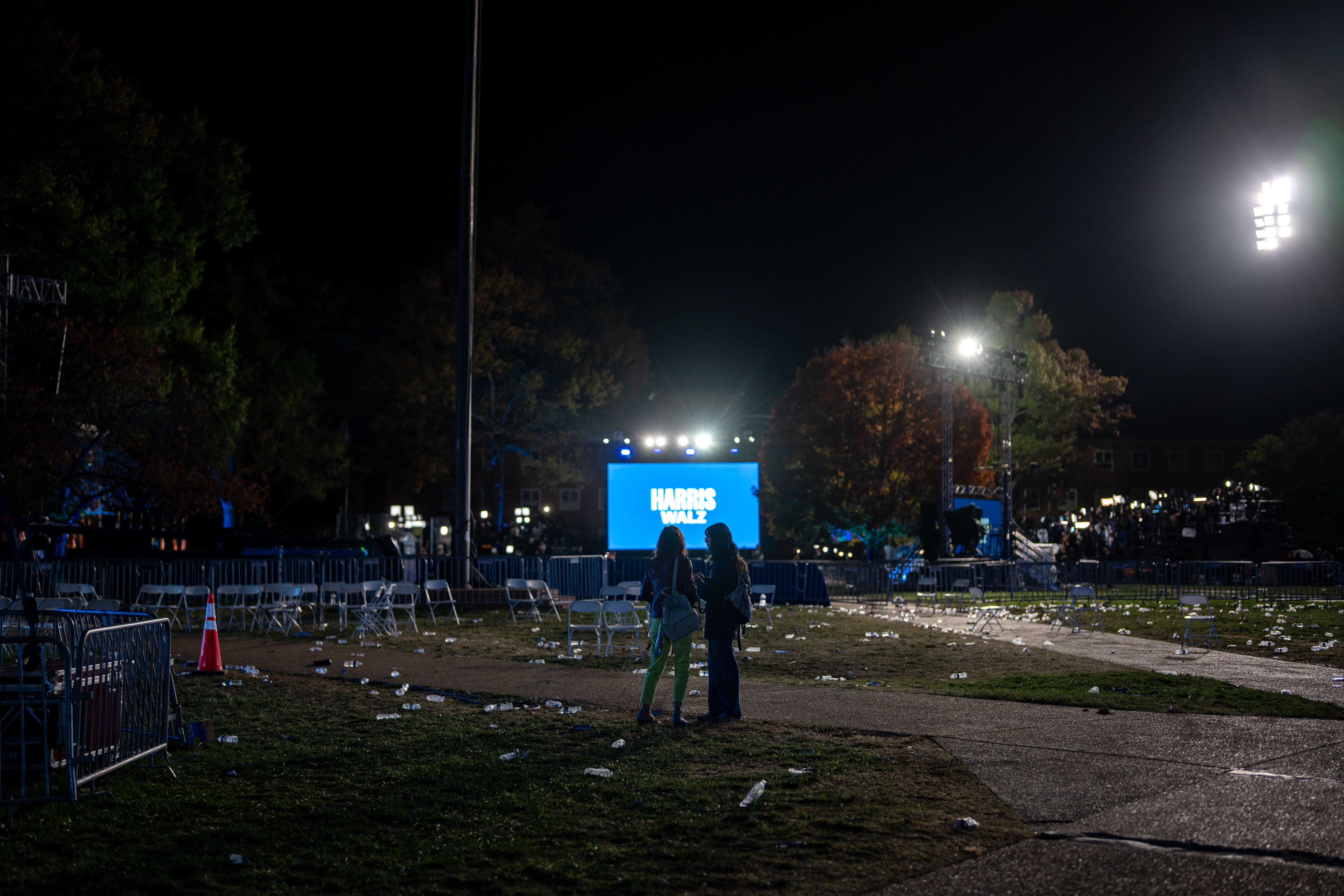 WASHINGTON, DC – NOVEMBER 06: People talk with each other, amid the chairs and trash in an empty field after the election night watch party for Democratic presidential nominee, U.S. Vice President Kamala Harris at Howard University on November 06, 2024 in Wshington, DC. Americans cast their ballots today in the presidential race between Republican nominee former President Donald Trump and Vice President Kamala Harris, as well as multiple state elections that will determine the balance of power in Congress. (Kent Nishimura/Getty Images)