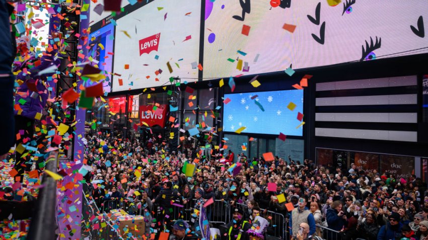 NEW YORK, NEW YORK – DECEMBER 29: People participate in the New Year’s Eve Confetti Test in Times Square on December 29, 2024 in New York City. On New Year’s Eve 3,000 pounds of confetti will be released over Times Square. (Photo by Alexi Rosenfeld/Getty Images)