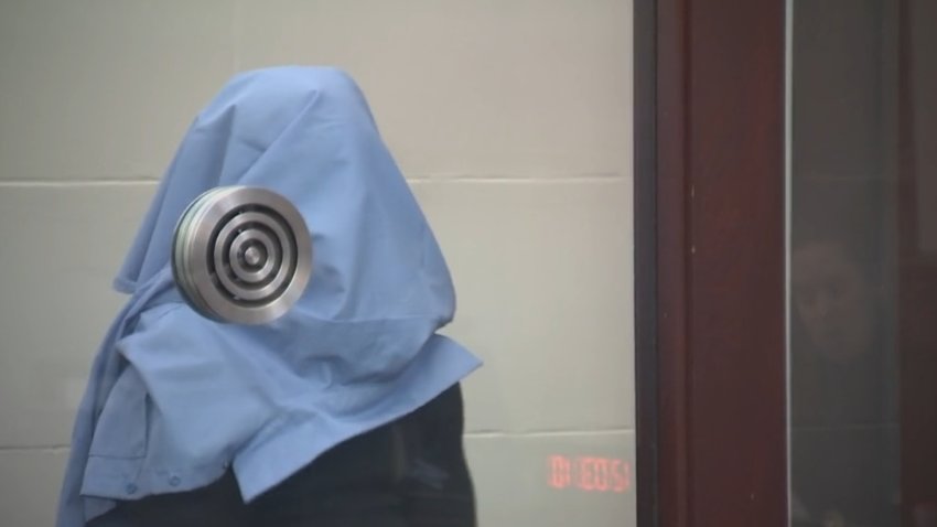 A man accused in a Boston stabbing appeared in court Friday, Dec. 6, 2024, with a shirt over his face.