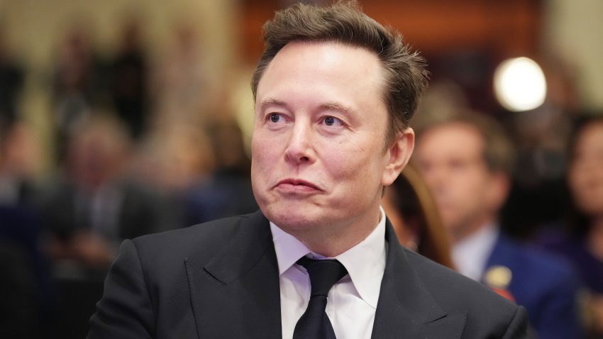 WASHINGTON, DC – NOVEMBER 13: Elon Musk listens as U.S. President-elect Donald Trump addresses a House Republicans Conference meeting at the Hyatt Regency on Capitol Hill on November 13, 2024 in Washington, DC. As is tradition with incoming presidents, Trump is traveling to Washington, DC to meet with U.S. President Joe Biden at the White House as well as meet with Republican congressmen on Capitol Hill. (Photo by Andrew Harnik/Getty Images)