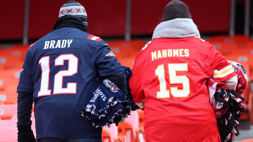 KANSAS CITY, MO – JANUARY 20: A man wearing a Tom Brady jersey, left, and a woman wearing a Patrick Mahomes jersey are pictured in the stands before the start of the game. The Kansas City Chiefs host the New England Patriots in an NFL AFC Championship game at Arrowhead Stadium in Kansas City, MO on Jan. 20, 2019. (Photo by Jim Davis/The Boston Globe via Getty Images)