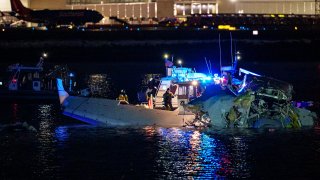 Emergency response units assess airplane wreckage