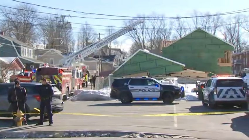 Police tape could be seen marking off a scene at a construction site on Vine Street in Weymouth, Massachusetts, on Tuesday.