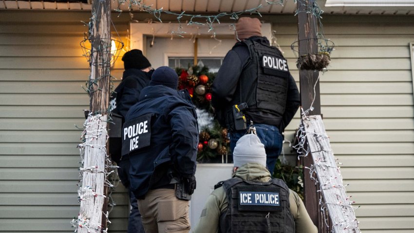 US Immigration and Customs Enforcement (ICE) agents knock on the door of a residence during a multi-agency targeted enforcement operation in Chicago, Illinois, US, on Sunday, Jan. 26, 2025. President Donald Trump has pledged to carry out the largest deportation effort in US history, vowing to ultimately deport all of the foreigners living in the country without permission. Photographer: Christopher Dilts/Bloomberg via Getty Images