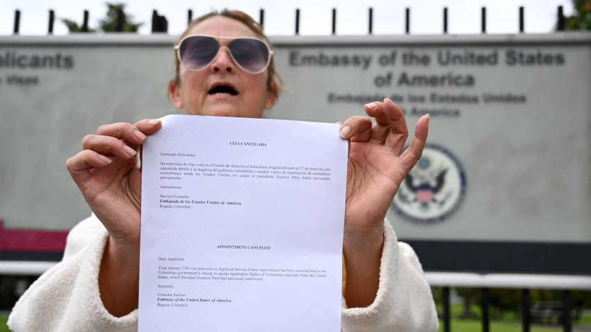 Colombian Milena Gonzalez shows a letter from the US embassy after her visa appointments was cancelled in Bogota on January 27, 2025. US Secretary of State Marco Rubio, whose wife is Colombian-American, suspended issuance of visas at the US embassy in Bogota and said visas would be revoked to Colombian government officials and their immediate family members. The White House said the visa measures would stay in place until the first planeload of deportees returns to Colombia. (Photo by Raul ARBOLEDA / AFP) (Photo by RAUL ARBOLEDA/AFP via Getty Images)