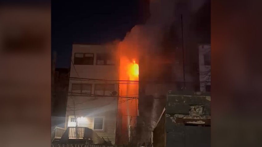 Flames shooting out of a building in East Boston on Feb. 20, 2025.