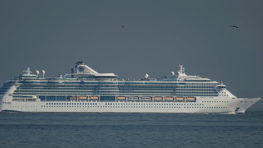 LISBON, PORTUGAL – APRIL 17: GTS Jewel of the Seas, a 90,090 GT Radiance-class cruise ship operated by Royal Caribbean, sails Cascais Bay after leaving Lisbon cruise terminal on April 17, 2024, in Lisbon, Portugal. The Port of Lisbon announced recently that cruise activity in Lisbon during 2023 was the best ever, exceeding 700,000 passengers for the first time, 54 percent more than the previous year. According to an economic impact study promoted by the Port of Lisbon Administration, cruise activity had a direct economic impact on the city of more than 83 million euros, considering the 102,680 passengers who embarked and the 554,324 who were in transit, for an embarked passenger spends an average of 367 euros and a passenger in transit 82 euros. Tourism generated 25 billion euros in Portugal during 2023, the best year ever for the country. (Photo by Horacio Villalobos#Corbis/Corbis via Getty Images)