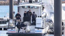 A diver on a Boston police boat at the Charlestown Marina on Tuesday, Feb. 4, 2025.