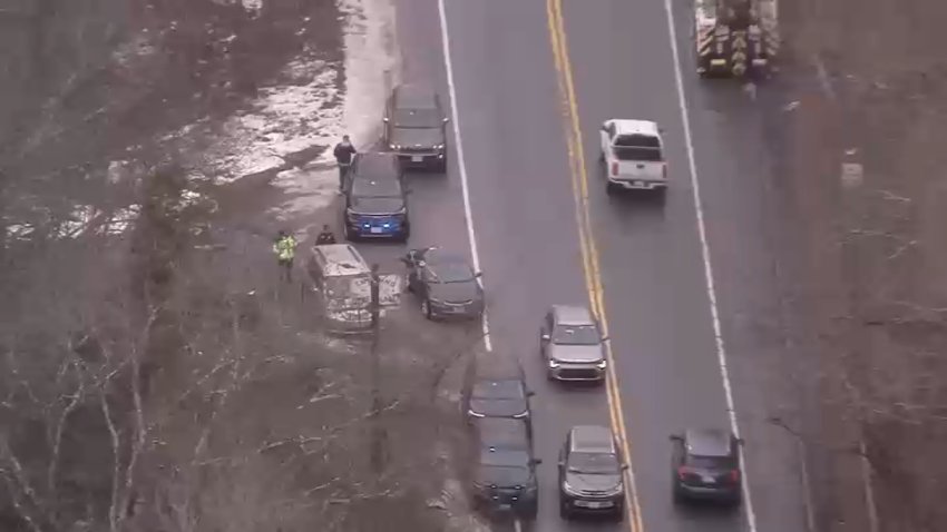 Police in Dedham, Massachusetts, near Cutler Park Reservation, amid a search for someone who fled a traffic stop on Thursday, Feb. 27, 2025.