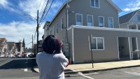 Talitha Frazier looks at the renovated home in Bridgeport where her brother-in-law lived
