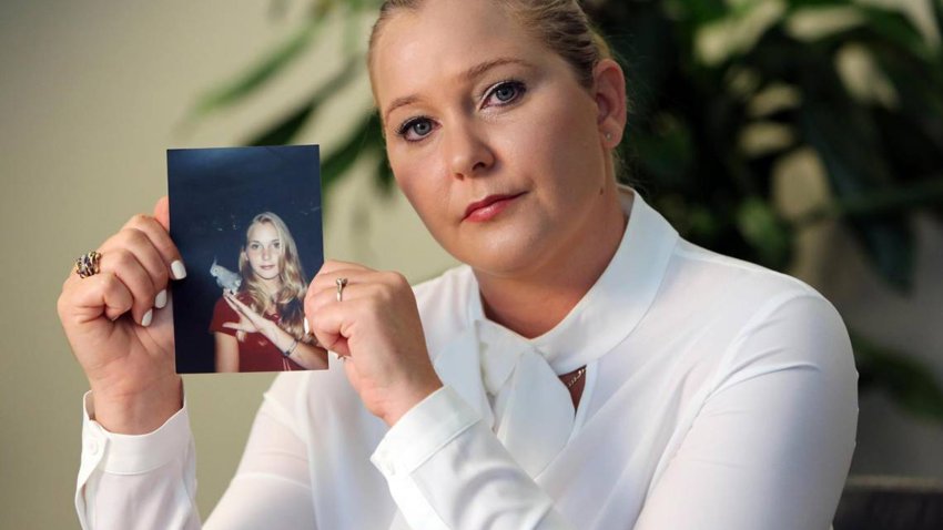 Virginia Roberts Giuffre holds a photo of herself as a teen, when she says she was abused by Jeffrey Epstein, Ghislaine Maxwell and Prince Andrew, among others.