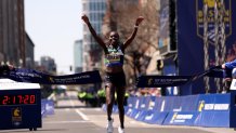 Sharon Lokedi of Kenya crosses the finish line to win the 129th Boston Marathon Women's division on Monday, April 21, 2025.