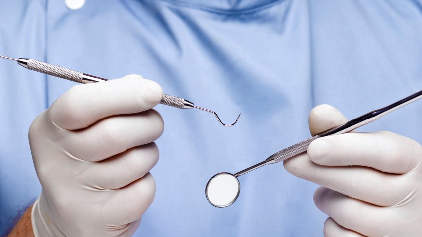File photo depicting a dentist with tools.