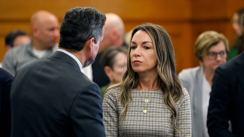 Karen Read talks with attorney Alan Jackson during her murder trial at Norfolk Superior Court in Dedham, Massachusetts, on Wednesday, May 7, 2025.