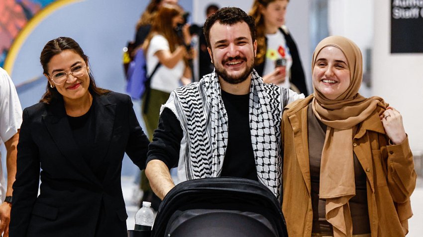 Former Columbia Univrsity student Mahmoud Khalil reacts as he arrives to Newark airport next to his wife Noor Abdalla (R) and US Representative Alexandria Ocasio-Cortez (L), Democrat of New York, in Newark, New Jersey, on June 21, 2025. Mahmoud Khalil, a former Columbia University student who was one of the most visible leaders of nationwide pro-Palestinian campus protests, was released on June 20 from a federal detention center. Khalil, a legal permanent resident in the United States who is married to a US citizen and has a US-born son, has been in custody since March facing potential deportation. (Photo by kena betancur / AFP) (Photo by KENA BETANCUR/AFP via Getty Images)