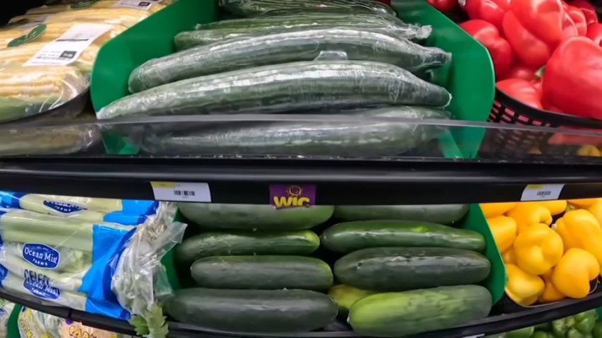 Vegetables, including cucumbers, bell peppers, celery and corn, at the grocery store.