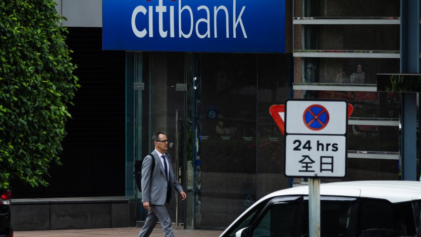 HONG KONG, CHINA – APRIL 16: A man walks past a Citibank branch on April 16, 2026, in Hong Kong, China. Citibank is the consumer division of Citigroup, a U.S.-based multinational financial services corporation. (Photo by Cheng Xin/Getty Images)