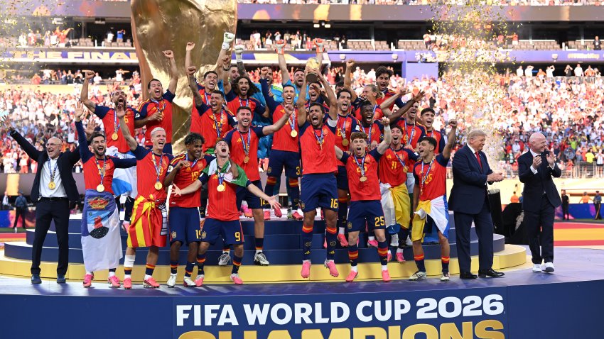 EAST RUTHERFORD, NEW JERSEY – JULY 19: Rodri #16 of Spain lifts the FIFA World Cup Winner’s Trophy alongside U.S. President Donald Trump and FIFA President Gianni Infantino after the team’s victory following during the FIFA World Cup 2026 Final match between Spain and Argentina at New York New Jersey Stadium on July 19, 2026 in East Rutherford, New Jersey. (Photo by David Ramos/Getty Images)