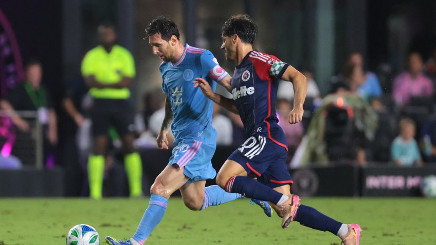 Oct 4, 2025; Fort Lauderdale, Florida, USA; Inter Miami CF forward Lionel Messi (10) dribbles the ball against New England Revolution midfielder Carles Gil (10) during the first half at Chase Stadium. Mandatory Credit: Sam Navarro-Imagn Images