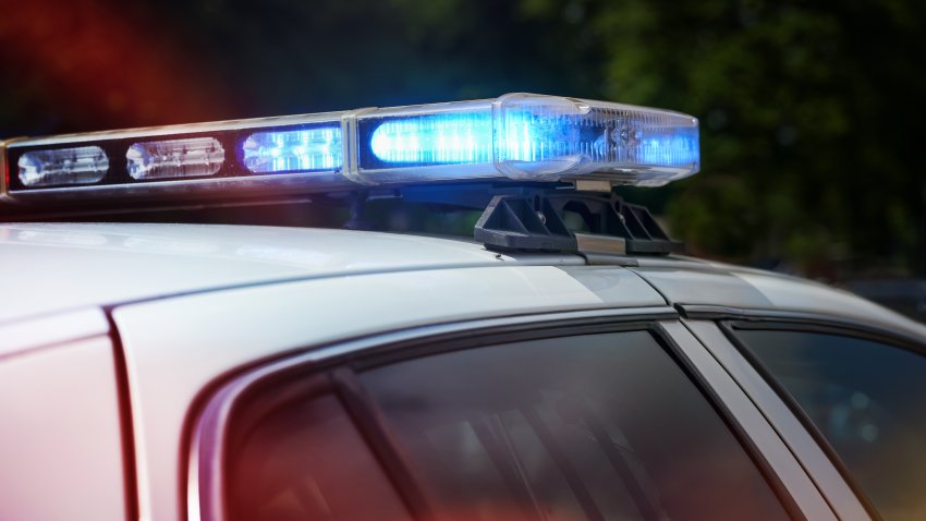 Automobile tuning, lightbar flashing LED blue light is mounted on the roof to look like an American police car, individual modification of the design, dark background, copy space, selected focus